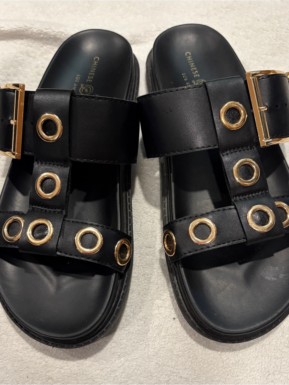 Chinese Laundry Black Slide Sandals with Gold Grommet Accents
